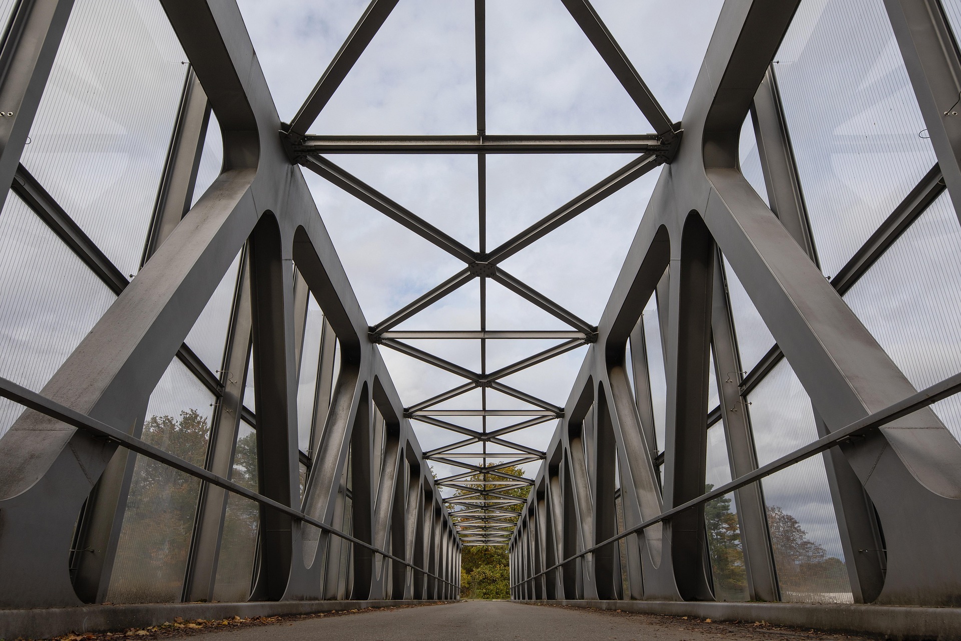A very straight and architectural bridge moving down the center to horizon.