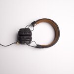 A central pair of headphones, symbolizing social listening.