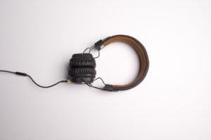 A central pair of headphones, symbolizing social listening.
