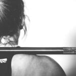 Strong woman athlete cross fit training with a weight bar.