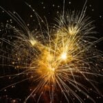 A range of fireworks exploding in the night sky.