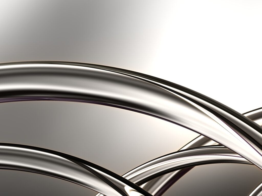 Shiny metal curving pipes or spokes.