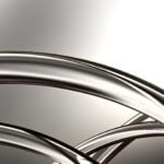 Shiny metal curving pipes or spokes.