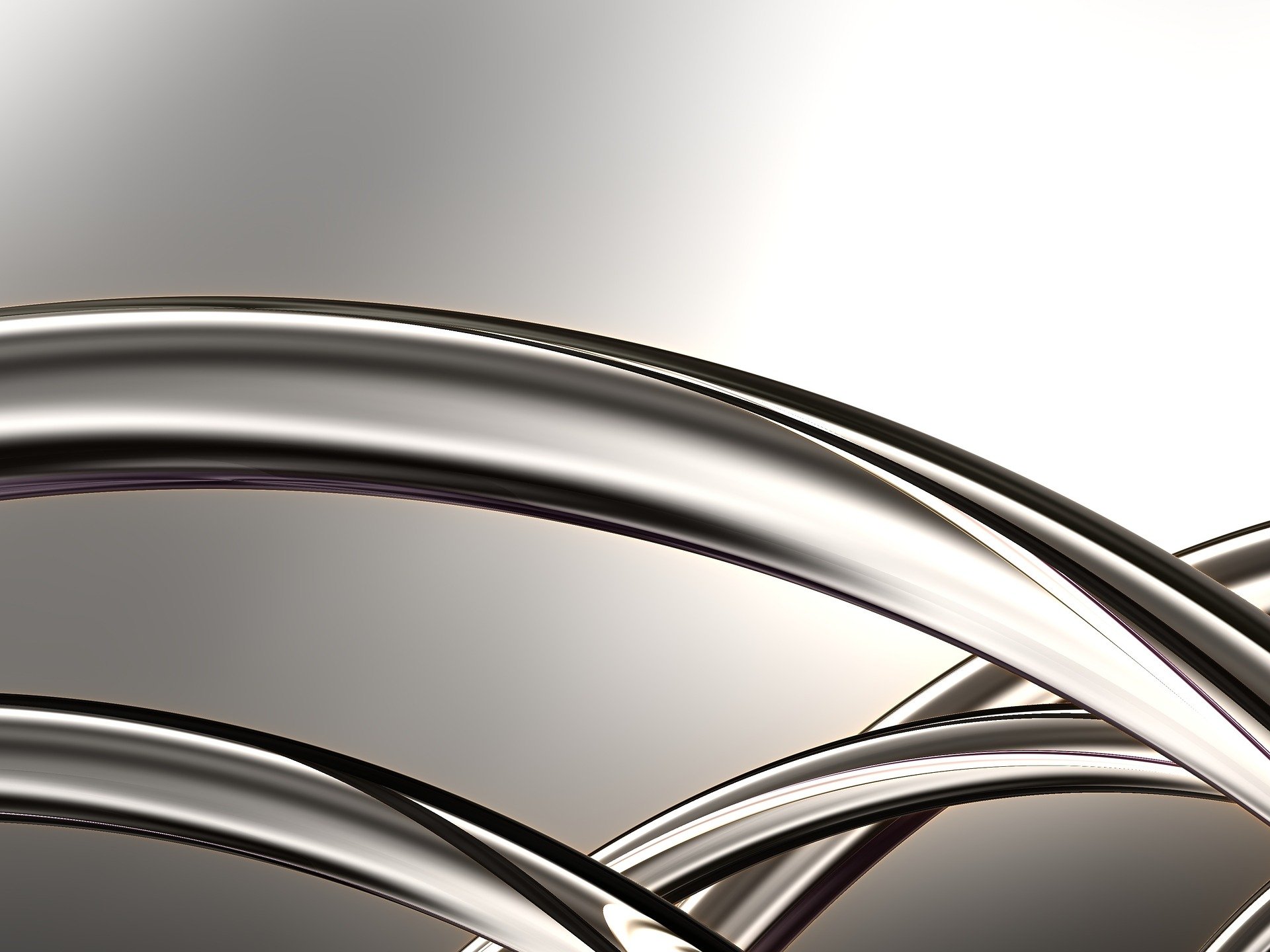 Shiny metal curving pipes or spokes.