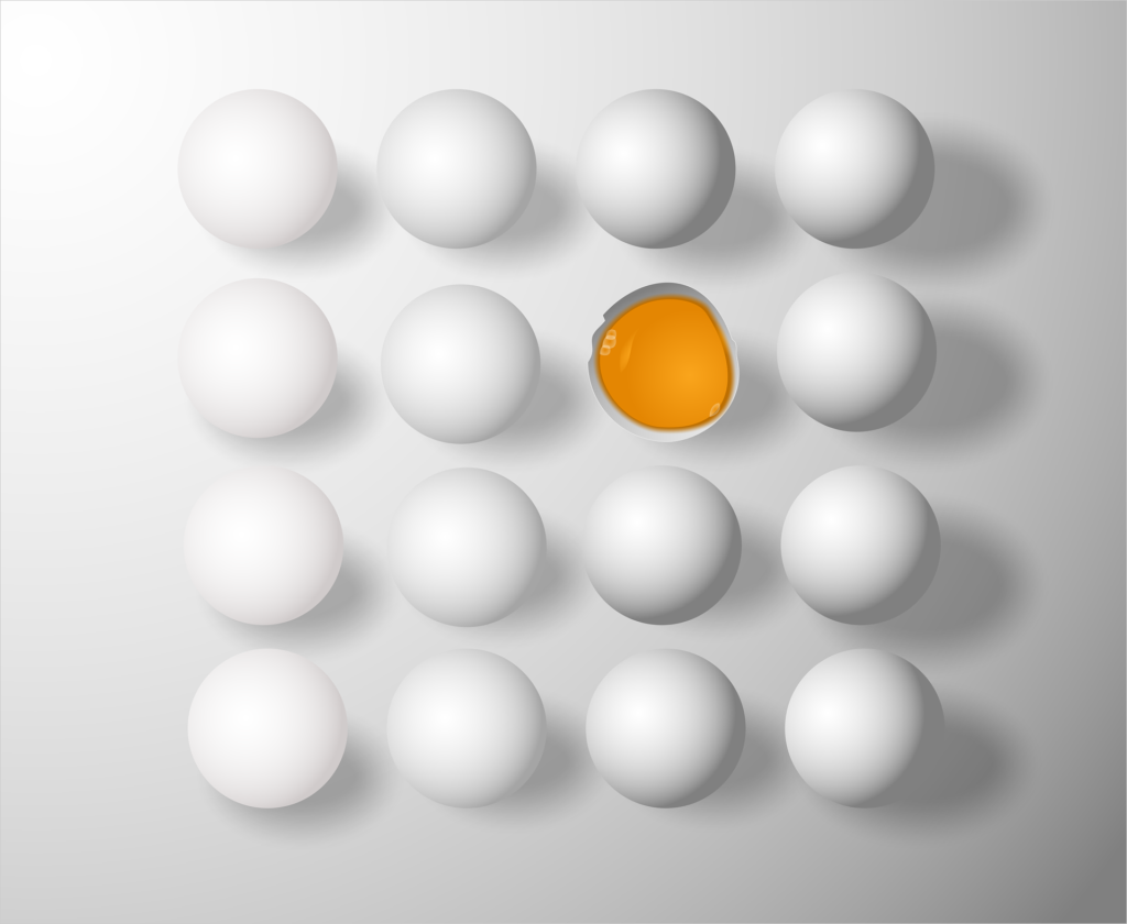 A grouping of white eggs, one of which is broken open and shows the yolk inside.