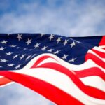 American flag unfurling in the sky.