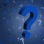 A background with questions in a jumble, with one big question mark front and center.