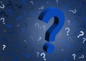 A background with questions in a jumble, with one big question mark front and center.